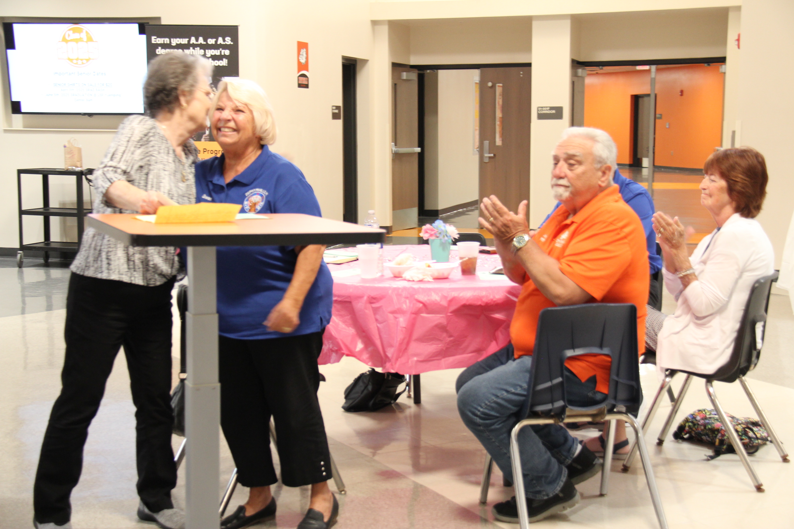 Judy Wilson, Volunteer Coordinator, hugs Gwen Klame, Zephyrhills Elks after she is presented with a $1000 check for the ABC Program.